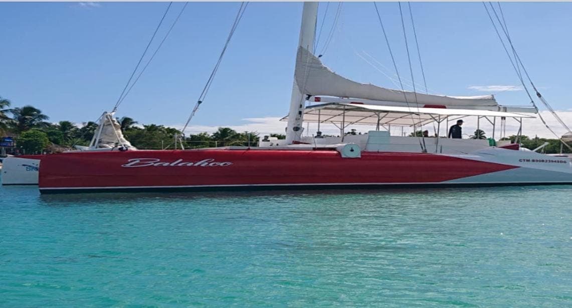 Catamaran in crystal clear water at Saona Island